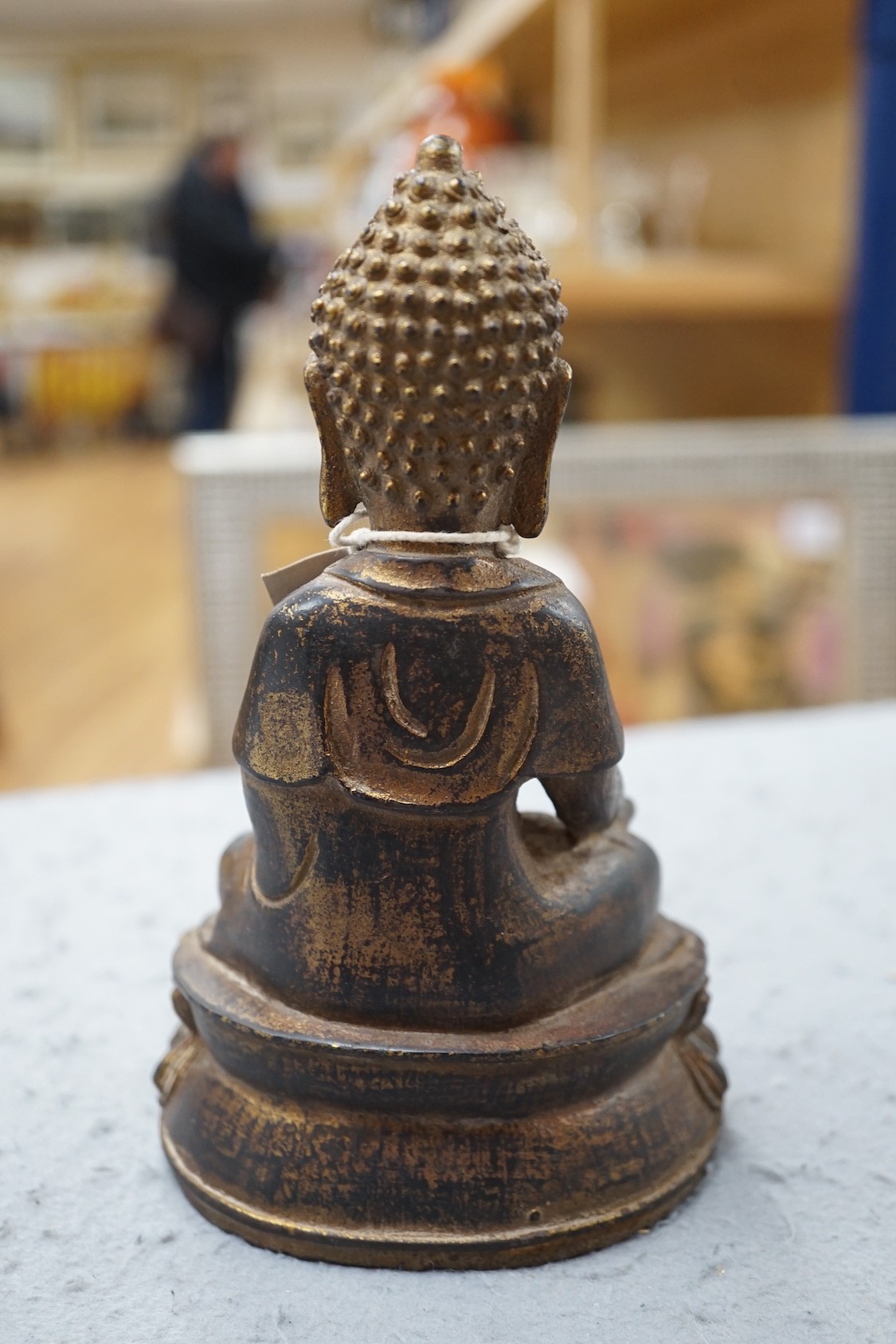 A Chinese gilt iron seated figure of Buddha, 19cm